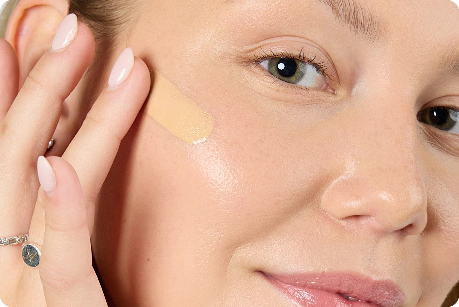 Closet Cleanout - 25% Off Full-Size Complexion: Model applying foundation to cheek