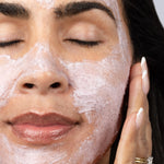 Polish & Radiate Exfoliating Dragon Fruit Mask - woman applying mask
