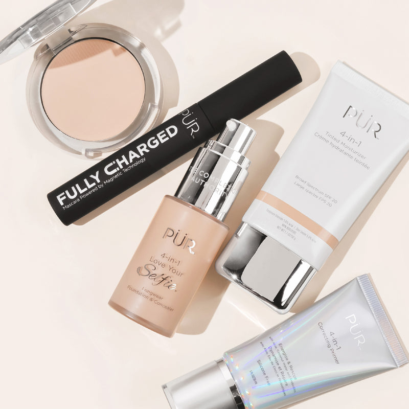 Multitasking Product - PUR Minerals 4-in-1 Pressed Powders, 4-in-1  Love Your Selfie, 4-in-1  Tinted Moisturizer, and Fully Charged Mascara, and Correcting Primer against a light off-white, beige background color