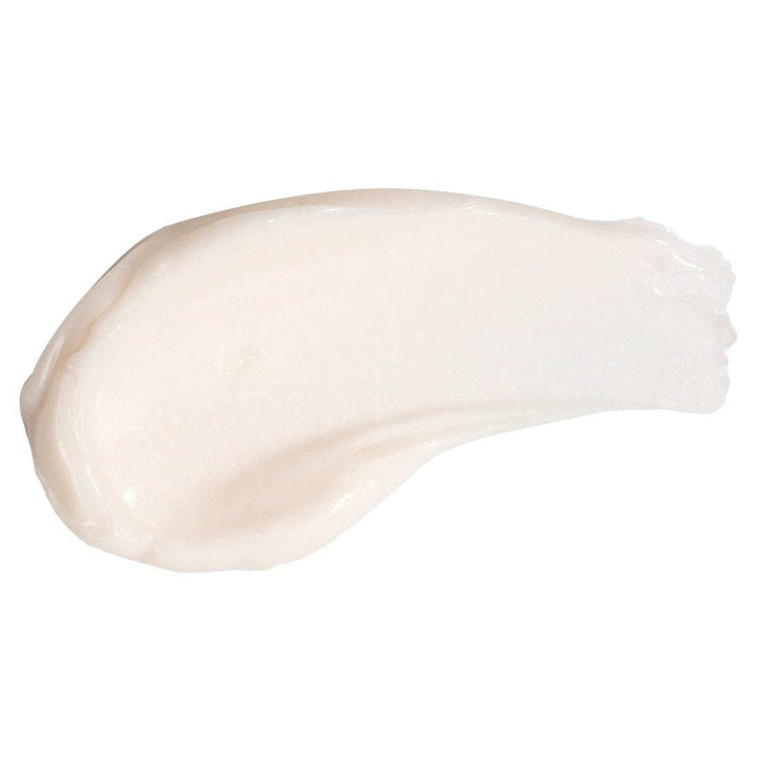 Creamy, lightweight swatch of PÜR Get A Lift Firming Facial Cream showing its silky, smooth texture.